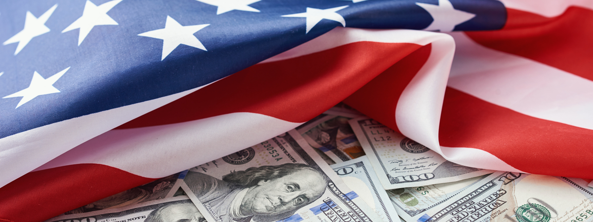 USA national flag and dollar bills. Business and finance concept