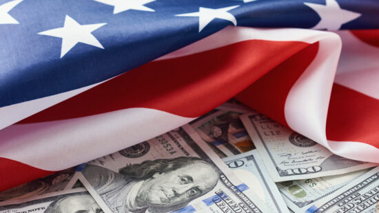 USA national flag and dollar bills. Business and finance concept